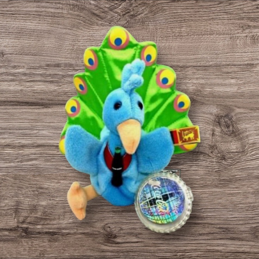 1999 coca-cola internation peacock plush bean bag still has the original tag